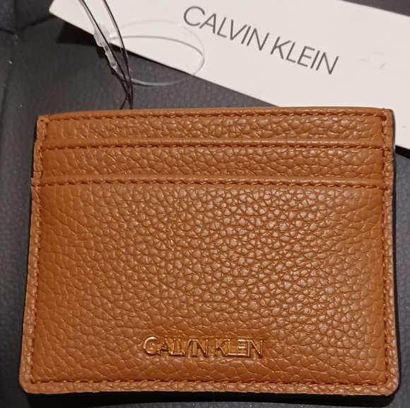 CALVIN KLEIN ID FLAT TAN BROWN LOGO WALLET
MEASURE - Picture 1 of 7